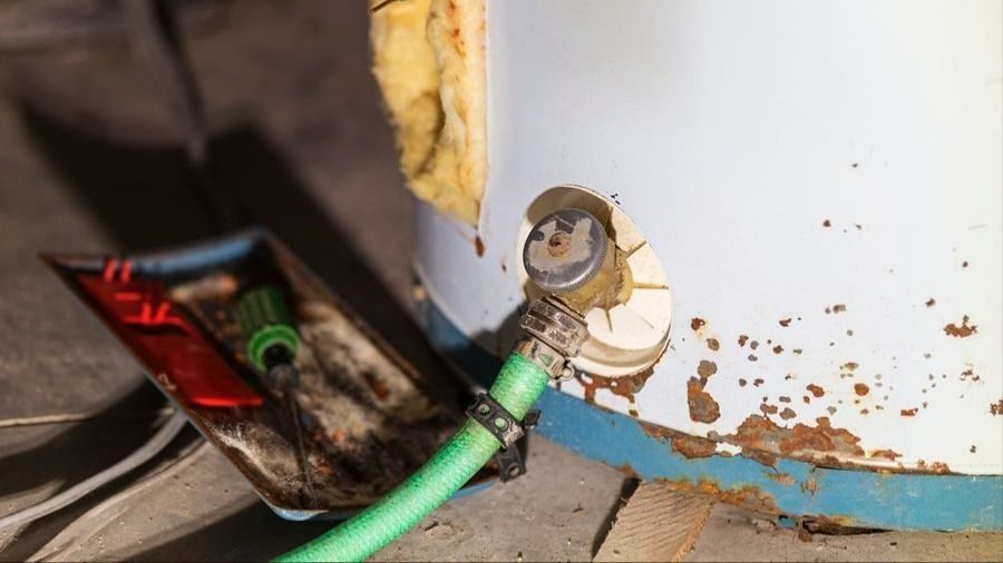 Hose attached to a water heater for flushing